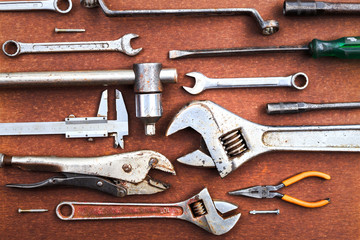 Working tools on wooden table background. top view