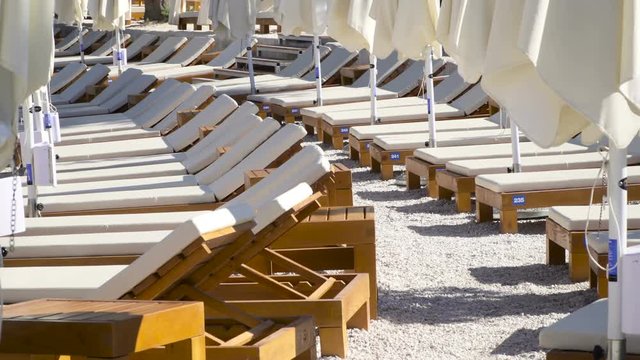 Tanning beds and umbrellas at the beach in Croatia.