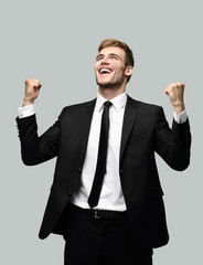 portrait of enthusiastic businessman isolated on a light background.