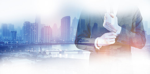 Double exposure of success business man city background.time for business.