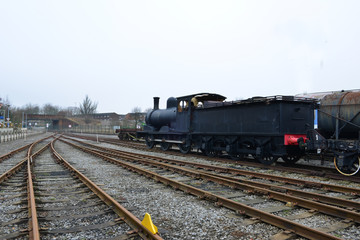 Fototapeta na wymiar An old steam locomotive left in a railway siding in the UK.