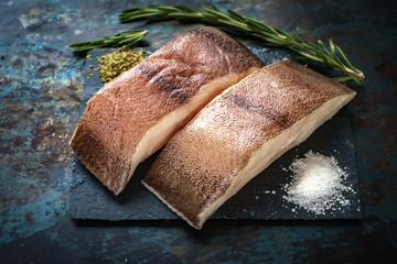 raw steak of sea fish on the stone