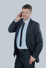 Portrait of a business man with phone isolated on white.