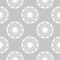 White floral seamless design on gray background