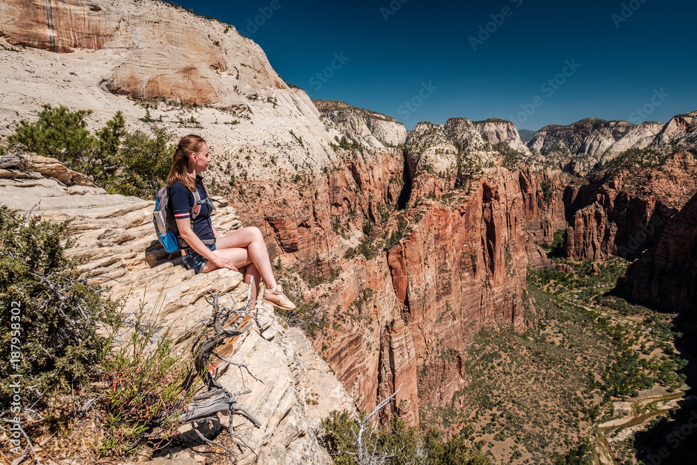 Wall mural Tourist with backpack hiking in Zion