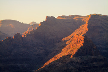 Fototapeta premium Mountains with canyons during sunset on Gran Canaria island. Retro filtered photography.