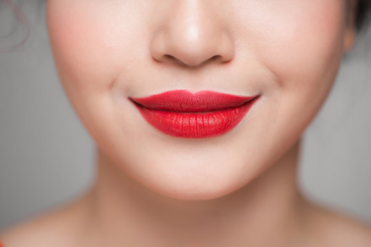 Close-up of beautiful perfect red lips. Selective focus.