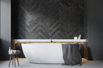 Black wooden bathroom, round tub close up