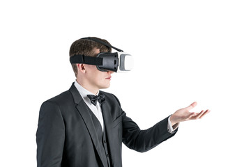 Businessman in VR glasses showing with a hand