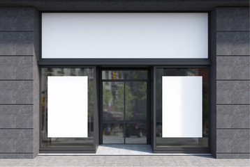 Dark gray and white cafe facade, two posters