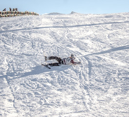 The fall of the skier in the snow