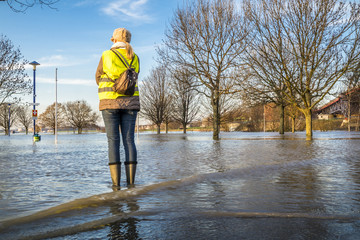 Lady standing in flooded street