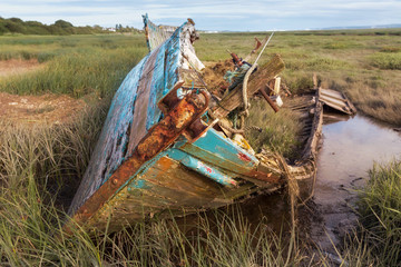 Fototapeta na wymiar Colorful boat wreck at Heswall near Liverpool