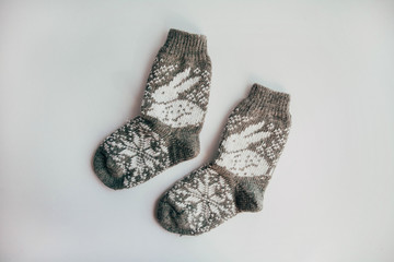 Handmade knitted socks for the cold season. View from above. Many different blue color socks.