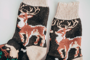 Handmade knitted socks for the cold season. View from above. Many different blue color socks.