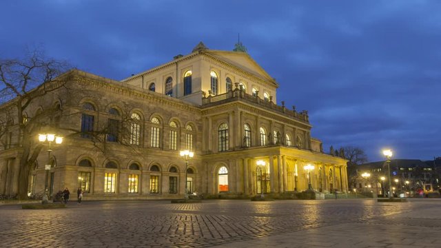 Hannover Opera House at winter evening. A theater built in classical style between 1845 and 1852. Time lapse. 4K.