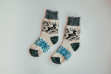 Handmade knitted socks for the cold season. View from above. Many different blue color socks.