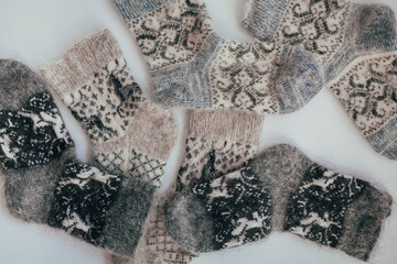 Handmade knitted socks for the cold season. View from above. Many different blue color socks.