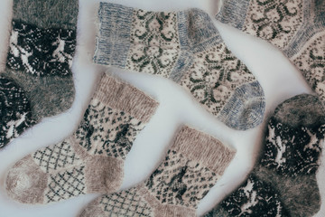 Handmade knitted socks for the cold season. View from above. Many different blue color socks.