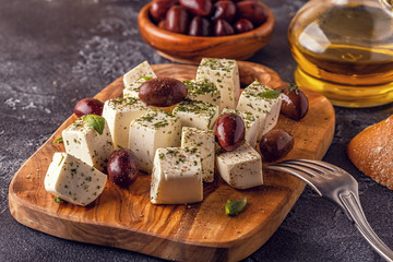 Greek cheese feta with oregano and olives.