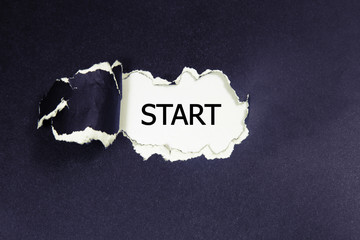 The word start written on torn paper
