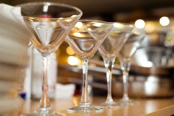 Empty glasses on table in night club or restaurant, closeup