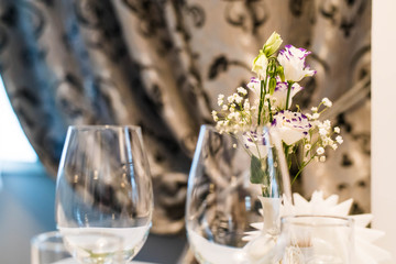 Empty glasses on table in night club or restaurant, closeup