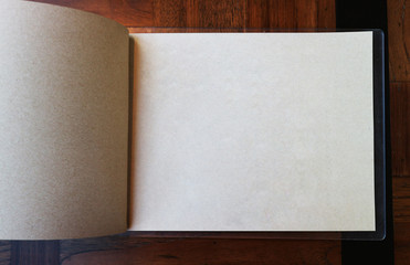 blank paper book, catalog, menu on wooden table Background.