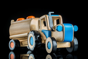 Wooden toy tractor with trailer
