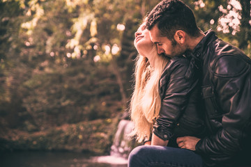 Young couple love moments in the park