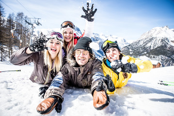 Group of friends having fun on the snow