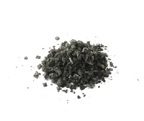 Pile of black salt crystals isolated