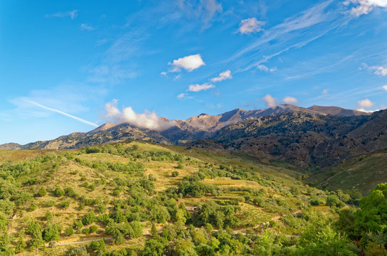 Mountains and meadows under blue sky on the island Grete, Greece