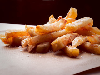 Closeup of a french fries with salt