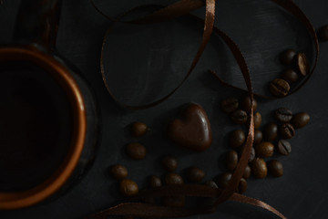 romantic arrangement of chocolate hearts and bean organic coffee