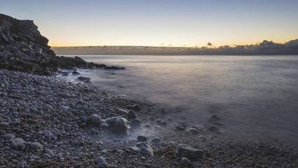 Beautiful sunrise landscape image of Church Ope Cove in Portland Dorest England