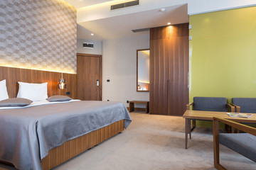 Naklejka na ściany i meble Hotel bedroom interior in the morning