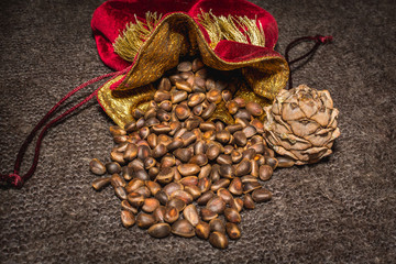 Siberian pine nuts in a red pouch with a bump on shawls