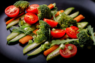 Salad with lettuce and fresh vegetable close up
