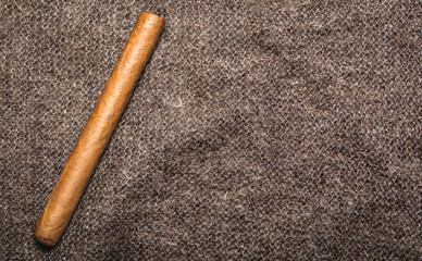 Beautiful Cuban cigar lies on shawls