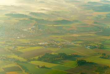 Aerial view of blurred background with beautiful fields in Bavaria, Germany