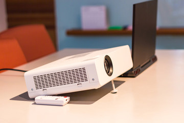 projector connected to Laptop on for  presentation in a meeting room, business concept.