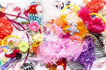 Fototapeta na wymiar Colorful collection of girl stuff like barettes and hair clips
