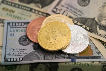 Bitcoins with US banknotes, golden bitcoin, silver bitcoin, bronze bitcoin