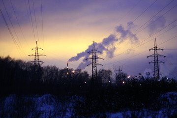 tower power plant in the background of a winter sunset and clouds