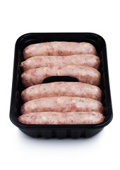 Plastic tray of raw pork beef sausages isolated
