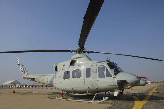 Military helicopter at a base