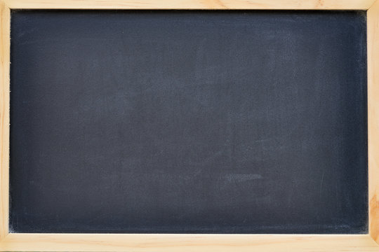 empty chalkboard in wood frame with free space for text