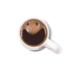 Coffee in a  cup with cream making spontaneous smiley