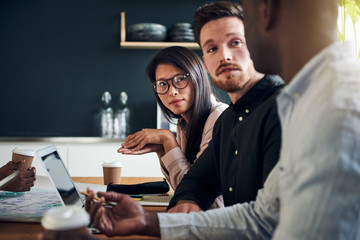 Diverse businesspeople having a meeting together in an office boardroom